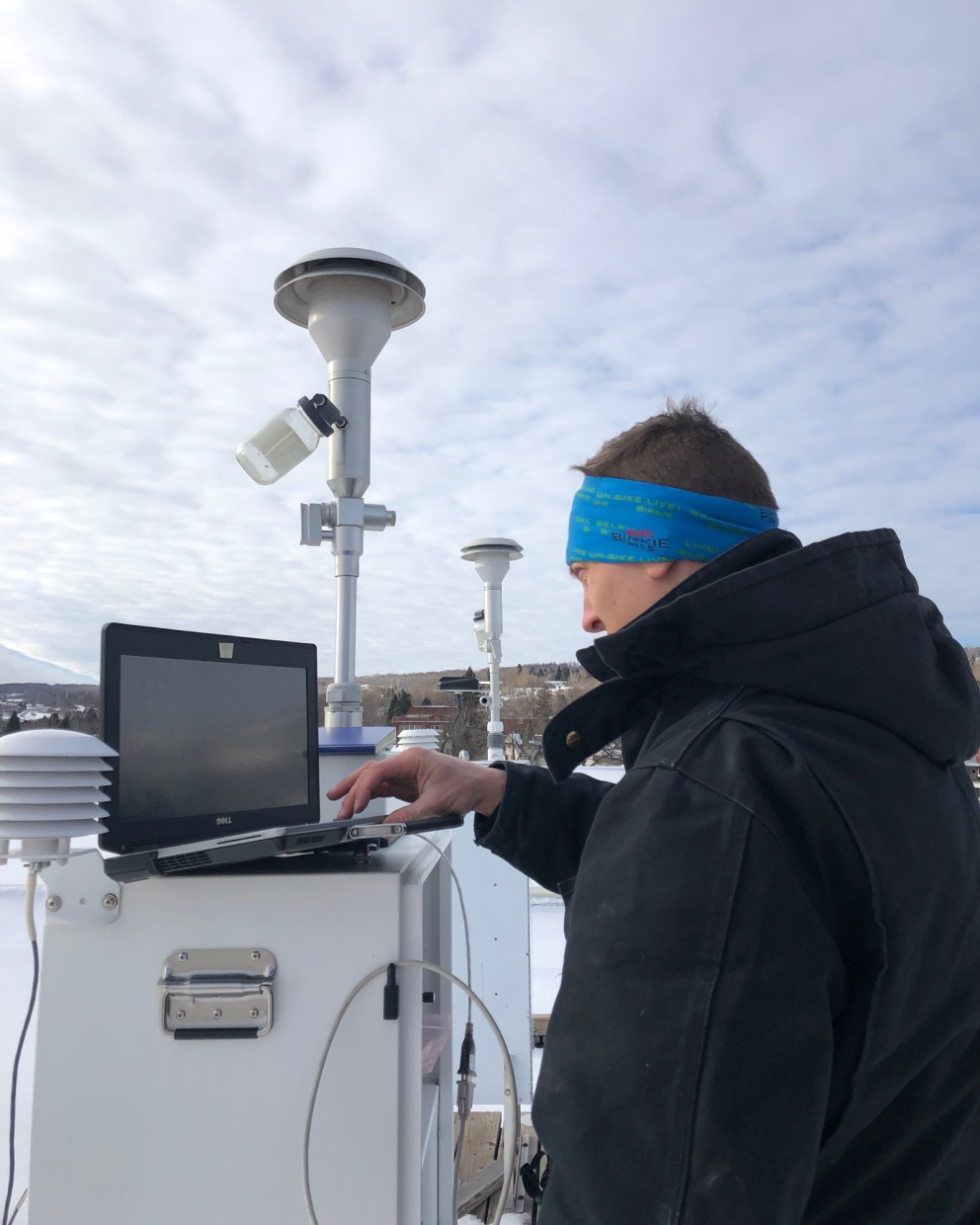 An MPCA air quality specialist checks on air monitoring equipment.