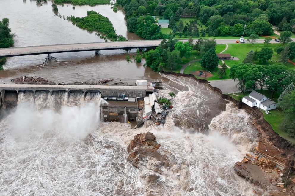 Aerial view of the flooding Blue Earth River eroding away large sections of the river bank around the west end of the Rapidan Dam in Minnesota.